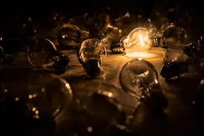 Hopeful Light Among Dark Glass Bulbs
