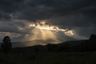 Golden Light Breaking Through Storm Clouds