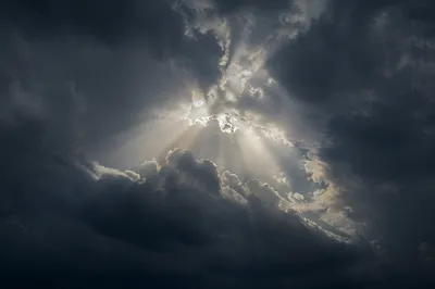 Hopeful Light Breaking Through Storm Clouds