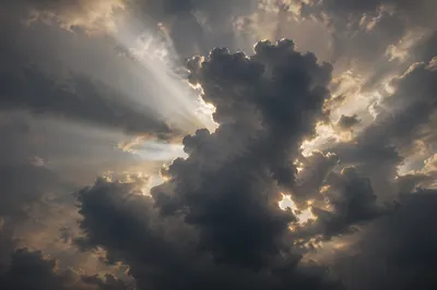 Hopeful Light Breaking Through Storm Clouds