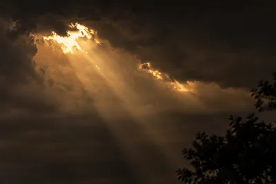 Golden Light Breaking Through Storm Clouds