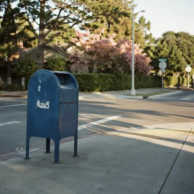 Blue Mailbox on Quiet Suburban Corner