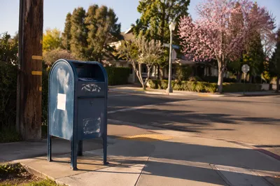 Blue Mailbox on Quiet Suburban Corner