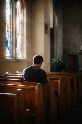 Solitary Prayer in Quiet Church Pew