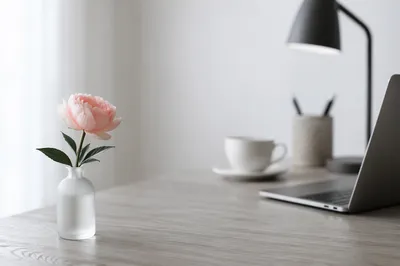 Minimalist Desk with Pale Pink Flower