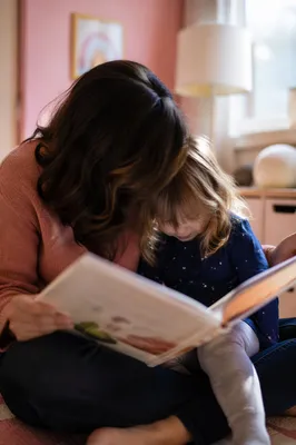 Mother and Child Reading Together Indoors