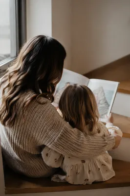 Mother and Child Reading by Window