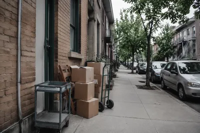 Moving Boxes Outside New Apartment Home