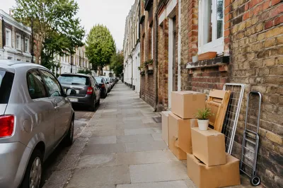 Moving Boxes Outside New Urban Home