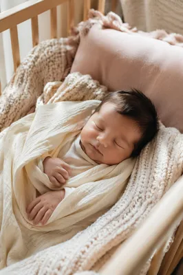 Sleeping Newborn on Soft Knit Blanket