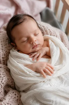 Sleeping Newborn on Soft Knitted Blanket