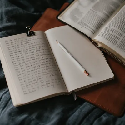 Open Notebook with Handwritten Scripture Notes