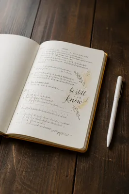 Open Scripture Notebook on Rustic Table