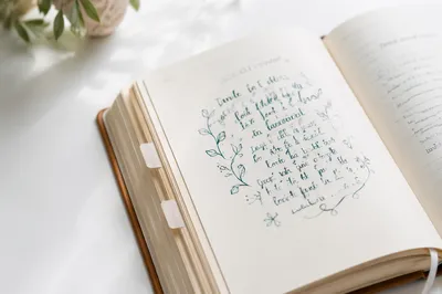 Open Notebook on White Tabletop