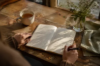 Morning Scripture Notebook on Wooden Table