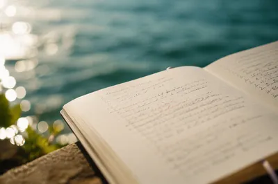 Open Notebook with Blurred Scripture Notes