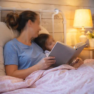 Parent Reading Bible at Child Bedtime