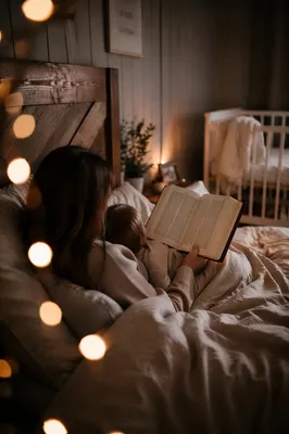 Parent Reading Bible to Child at Bedtime