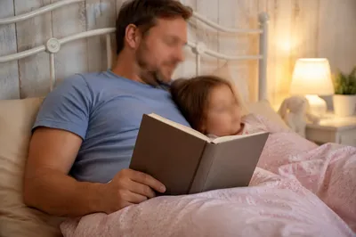 Parent Reading Bible at Child Bedtime
