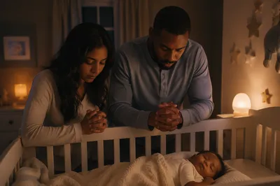Parents Praying Beside Baby Crib at Night