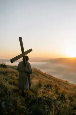 Solitary Pilgrim Carrying Cross at Dawn