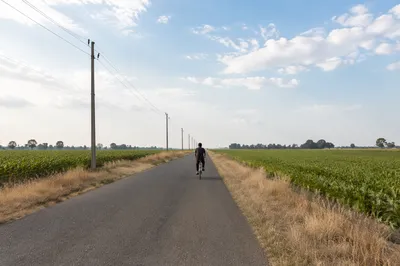 Cyclist on Quiet Countryside Road