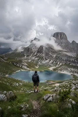 Lone Hiker Over Turquoise Alpine Lakes