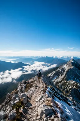 Lone Hiker on Mountain Ridge Trail