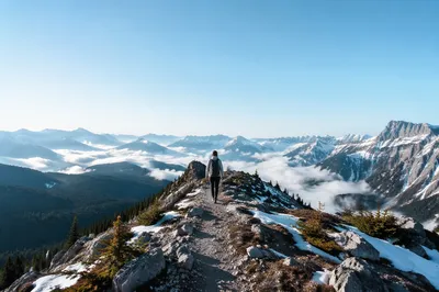 Lone Hiker on Alpine Ridge Trail
