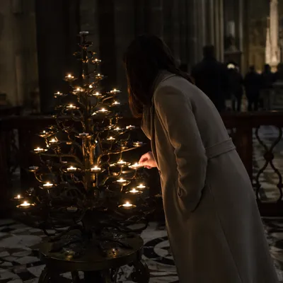 Candlelit Prayer Moment in Historic Church