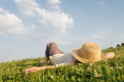 Relaxing on Grass Watching Spring Clouds