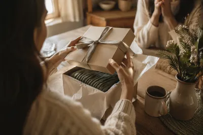 Joyful Gift Opening at Cozy Kitchen Table
