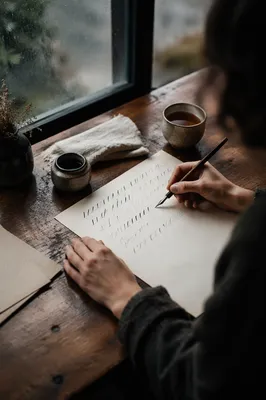 Calligraphy Practice by Rainy Window Desk