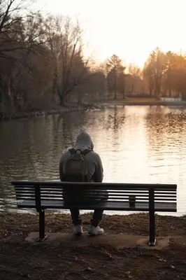 Solitary Park Bench Reflection by Winter Lake
