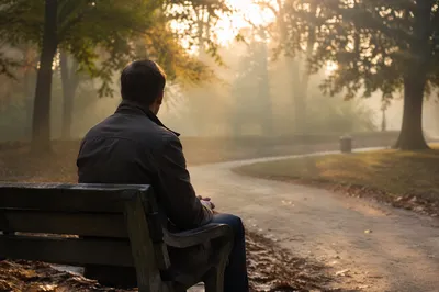 Solitary Reflection on a Misty Park Bench