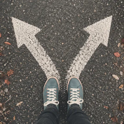 Crossroads Decision With Diverging Painted Arrows