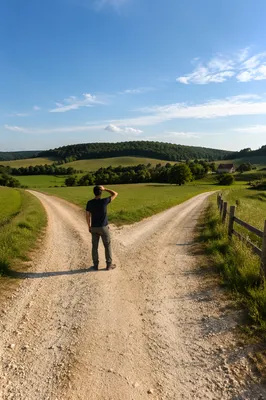 Person Choosing Path at Rural Crossroads