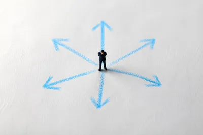 Business Figurine Facing Crossroads Choices