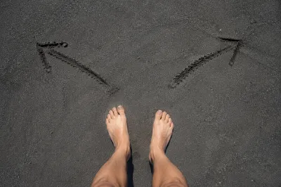 Barefoot Crossroads Decision on Volcanic Sand