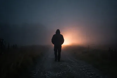 Lone Walker Entering Foggy Evening Light