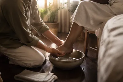 Compassionate Foot Washing Service in Warm Light