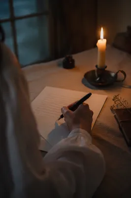 Handwritten Letter by Warm Candlelight