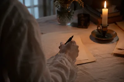 Handwritten Letter by Warm Candlelight