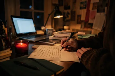 Candlelit Handwritten Letter at Night Desk