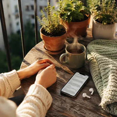 Quiet Morning Balcony Table With Smartphone