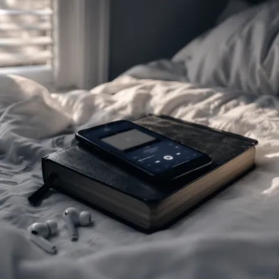Smartphone and Earbuds on Black Bible