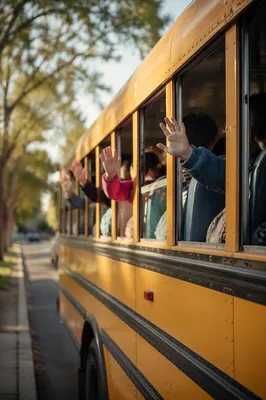 Children Waving From Yellow School Bus