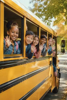 Children Waving from Yellow School Bus