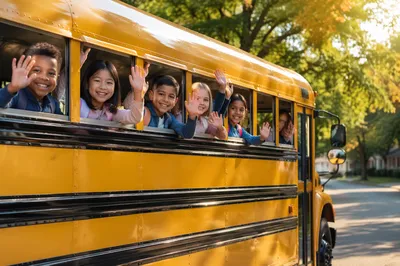 Children Waving from Yellow School Bus