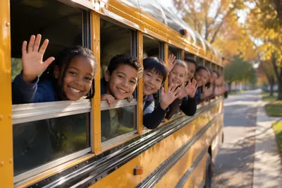 Children Waving from Yellow School Bus